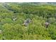 Lush canopy surrounds this secluded home with mature landscaping at 20322 Wagon Trail Dr, Noblesville, IN 46060