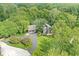 Secluded home featuring mature landscaping, sprawling lawn, and an attached garage at 20322 Wagon Trail Dr, Noblesville, IN 46060