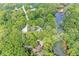 Expansive property featuring lush, green trees, a serene river, and a well-maintained home at 20322 Wagon Trail Dr, Noblesville, IN 46060