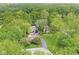 Secluded home featuring mature landscaping, sprawling lawn, and an attached garage at 20322 Wagon Trail Dr, Noblesville, IN 46060