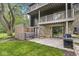 A multi-level backyard with hot tub, stone wall, and an outdoor grill, perfect for entertaining in a private setting at 20322 Wagon Trail Dr, Noblesville, IN 46060