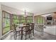 Well-lit dining room with views of backyard fireplace, creating inviting space at 20322 Wagon Trail Dr, Noblesville, IN 46060