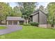 Beautiful home with a two-car garage and a large front yard with mature trees at 20322 Wagon Trail Dr, Noblesville, IN 46060