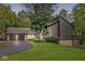 Beautiful home with a two-car garage and a large front yard with mature trees at 20322 Wagon Trail Dr, Noblesville, IN 46060