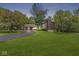 Captivating two-story home with a well-manicured lawn, mature trees, and a detached two-car garage at 20322 Wagon Trail Dr, Noblesville, IN 46060