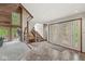 Bright foyer with tiled floors, wooden staircase, and large windows, creating a welcoming and stylish entrance at 20322 Wagon Trail Dr, Noblesville, IN 46060