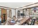 Well-lit home office with custom shelving, a large desk, and multiple entrances to the home at 20322 Wagon Trail Dr, Noblesville, IN 46060