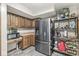 Kitchen featuring stainless steel appliances, wooden cabinets, and practical layout at 20322 Wagon Trail Dr, Noblesville, IN 46060