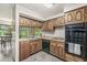 Cozy kitchen features wood cabinets, ample natural light and views of the backyard at 20322 Wagon Trail Dr, Noblesville, IN 46060