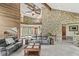 Spacious living room with stone accent wall, vaulted ceilings, and cozy furniture at 20322 Wagon Trail Dr, Noblesville, IN 46060