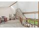 Open loft area with stone detailing, wooden beams, and cozy seating at 20322 Wagon Trail Dr, Noblesville, IN 46060