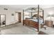 Spacious main bedroom with a four-poster bed, dresser, and carpeting at 20322 Wagon Trail Dr, Noblesville, IN 46060