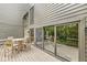Enjoy outdoor dining on this expansive patio with sliding glass doors, perfect for entertaining and enjoying nature at 20322 Wagon Trail Dr, Noblesville, IN 46060