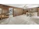 Recreation room with a wet bar and wood paneling at 20322 Wagon Trail Dr, Noblesville, IN 46060