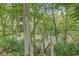 Wooden steps leading down to a river through a wooded area at 20322 Wagon Trail Dr, Noblesville, IN 46060