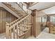 Inviting carpeted staircase with wood trim and a view into the living area at 20322 Wagon Trail Dr, Noblesville, IN 46060