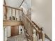 Elegant wooden staircase with detailed railings leading to the upper level at 20322 Wagon Trail Dr, Noblesville, IN 46060