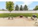 An outdoor patio with a fire pit, grill, and lawn surrounded by a privacy fence at 2260 Santa Fe Dr, Greenfield, IN 46140