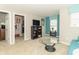 Basement living room featuring neutral carpet, a blue sofa, and a modern glass coffee table at 2260 Santa Fe Dr, Greenfield, IN 46140