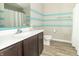 Bright, updated bathroom with modern fixtures and ample vanity storage at 2260 Santa Fe Dr, Greenfield, IN 46140