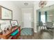 Welcoming entryway featuring elegant decor, a wood console table, and a view into the dining area at 2260 Santa Fe Dr, Greenfield, IN 46140