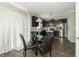 Open concept kitchen with stainless steel appliances and a dining table with seating for four at 2260 Santa Fe Dr, Greenfield, IN 46140