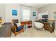 A functional office with a computer, white board, decorative painting and comfortable seating at 2260 Santa Fe Dr, Greenfield, IN 46140