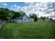 This backyard features a large grassy area and street access at 2358 Hovey St, Indianapolis, IN 46218