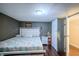 This bedroom features hard wood floors and a queen size bed at 2358 Hovey St, Indianapolis, IN 46218
