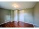 Cozy bedroom featuring hardwood floors, neutral walls, and ample closet space at 2358 Hovey St, Indianapolis, IN 46218