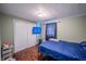 This bedroom features hard wood floors and a double door closet at 2358 Hovey St, Indianapolis, IN 46218
