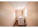 This laundry room features a window and storage shelf at 2358 Hovey St, Indianapolis, IN 46218