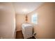 This laundry room features a window and storage shelf at 2358 Hovey St, Indianapolis, IN 46218