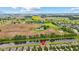 The residence is near the Legends Golf Course; the aerial view highlights the home's location and surrounding landscape at 2509 Cedarmill Dr, Franklin, IN 46131