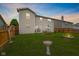 Spacious backyard featuring a fire pit, well-maintained lawn, and outdoor seating area at 2509 Cedarmill Dr, Franklin, IN 46131