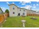 Spacious backyard featuring a well-maintained lawn, fenced perimeter, and patio area at 2509 Cedarmill Dr, Franklin, IN 46131