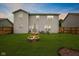 Spacious backyard featuring a fire pit, well-maintained lawn, and outdoor seating area at 2509 Cedarmill Dr, Franklin, IN 46131
