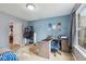 Bright, well-lit bedroom with a large window, a desk, carpeted floors, and direct access to additional rooms at 2509 Cedarmill Dr, Franklin, IN 46131