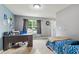 Bright bedroom with a large window, neutral walls, a desk, and carpeted flooring at 2509 Cedarmill Dr, Franklin, IN 46131