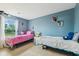 Comfortable bedroom with colorful decor, two beds, and a bright window view at 2509 Cedarmill Dr, Franklin, IN 46131
