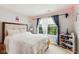 Cozy bedroom with a bright window, a comfortable bed, and colorful decorations at 2509 Cedarmill Dr, Franklin, IN 46131
