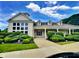 Inviting community clubhouse featuring lush landscaping, a covered entrance, and ample windows at 2509 Cedarmill Dr, Franklin, IN 46131