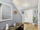 The entryway features neutral walls, a decorative mirror, and a stylish console table at 2509 Cedarmill Dr, Franklin, IN 46131
