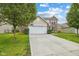 Beautiful exterior of a two-story home with a well-kept lawn and mature trees at 2509 Cedarmill Dr, Franklin, IN 46131