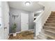 The foyer boasts tile flooring, a staircase, and a convenient coat rack at 2509 Cedarmill Dr, Franklin, IN 46131