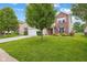 A well-manicured front yard complements this lovely two-story home with great curb appeal at 2509 Cedarmill Dr, Franklin, IN 46131