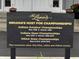Sign showing The Legends Golf Club, Indiana's host for Championships, with event details listed below the title at 2509 Cedarmill Dr, Franklin, IN 46131