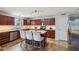Kitchen featuring an island, bar stool seating, and stainless steel appliances at 2509 Cedarmill Dr, Franklin, IN 46131
