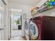 Well-equipped laundry room with modern appliances and ample storage, adjacent to a bright mudroom at 2509 Cedarmill Dr, Franklin, IN 46131
