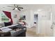 Upstairs living room with carpet floors, ceiling fan, and a comfortable sectional sofa at 2509 Cedarmill Dr, Franklin, IN 46131